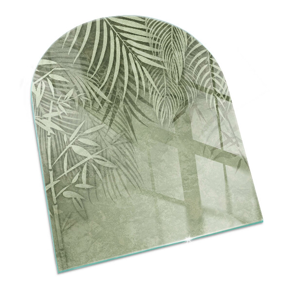 Glass hearths for wood burners Tropical leaves in the background