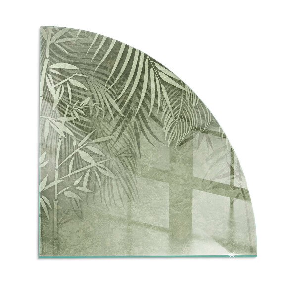 Glass hearth for wood stove Tropical leaves in the background