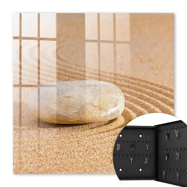 Wall mounted key box Stone on the sand, gentle waves