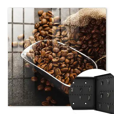 Key cabinet Coffee beans in a metal ladle