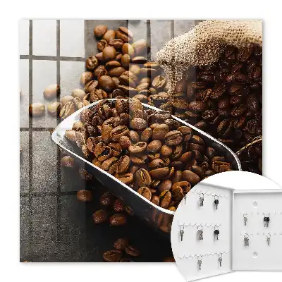 Key cabinet Coffee beans in a metal ladle
