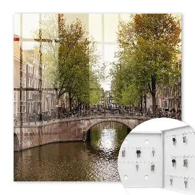 Wall mounted key cabinet The city canal is green with trees