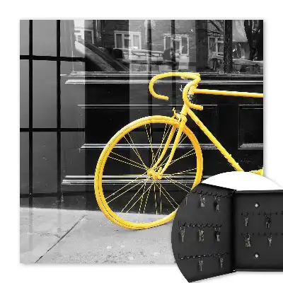 Key box for home A yellow bike in a black and white background