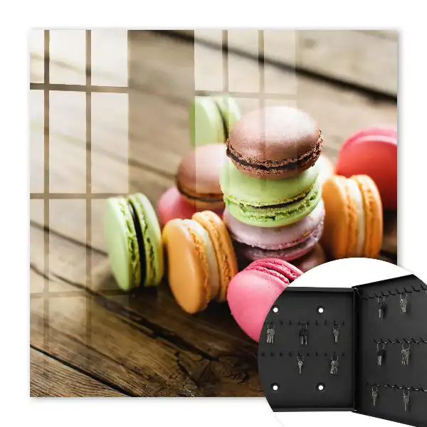 Decorative key box with a colorful sweets design on a wooden background