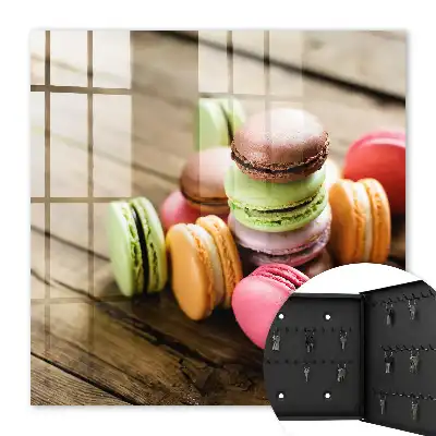 Decorative key box with a colorful sweets design on a wooden background