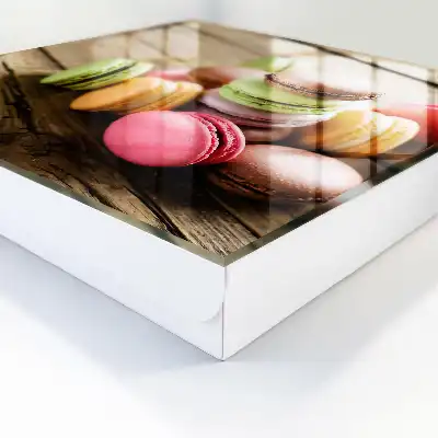 Decorative key box with a colorful sweets design on a wooden background