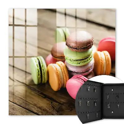Decorative key box with a colorful sweets design on a wooden background