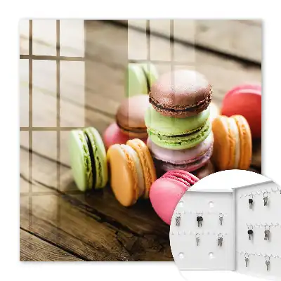Decorative key box Colorful sweets on a wooden background
