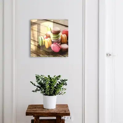 Decorative key box with a colorful sweets design on a wooden background