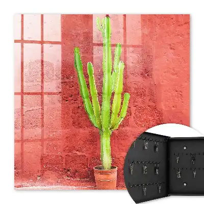 Wall mounted key box Green cactus on a red wall