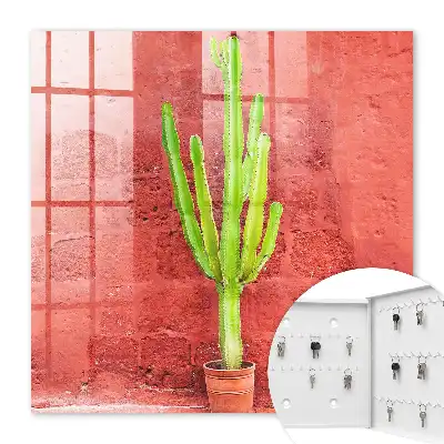 Wall mounted key box Green cactus on a red wall