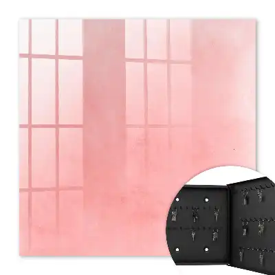 Wall mounted key cabinet Pink background with a subtle pattern