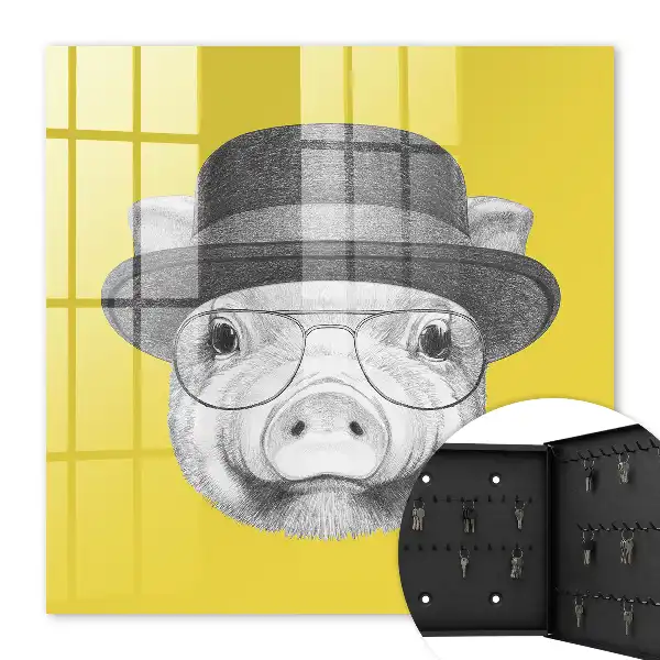 Wall mounted key box A cheerful yellow pig in the background