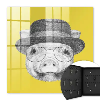 Wall mounted key box A cheerful yellow pig in the background