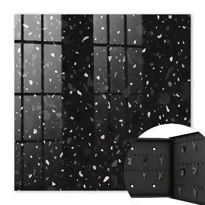Wall mounted key cabinet Black terrazzo in the background