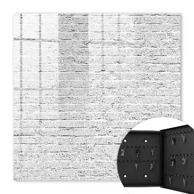 Wall mounted key cabinet Brick wall with a rough texture