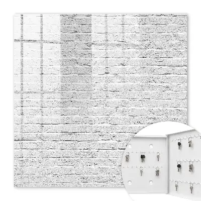 Wall mounted key cabinet Brick wall with a rough texture