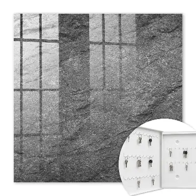 Wall mounted key cabinet in gray stone