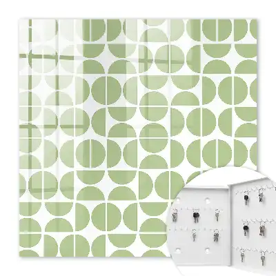 Wall mounted key cabinet Green geometry on white background