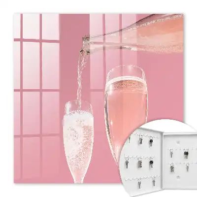 Wall mounted key cabinet Champagne glasses with pink background