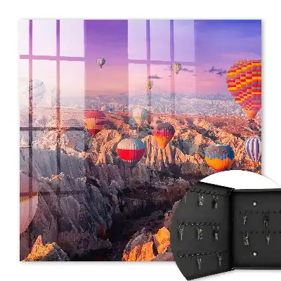 Wall mounted key cabinet Balloons in the air over a rocky valley
