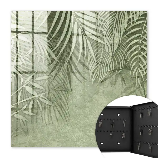 Wall mounted key cabinet with a subtle tropical background pattern