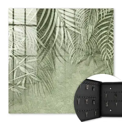 Wall mounted key cabinet with a subtle tropical background pattern