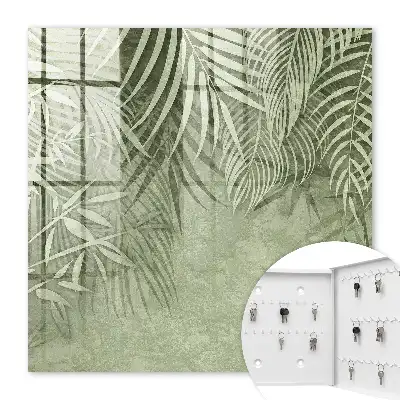 Wall mounted key cabinet with a subtle tropical background pattern