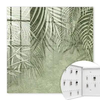 Wall mounted key cabinet with a subtle tropical background pattern