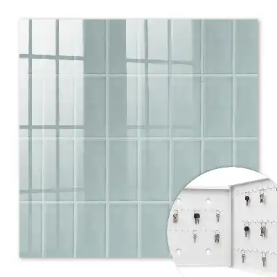 Wall mounted key cabinet Blue tiles in muted tones