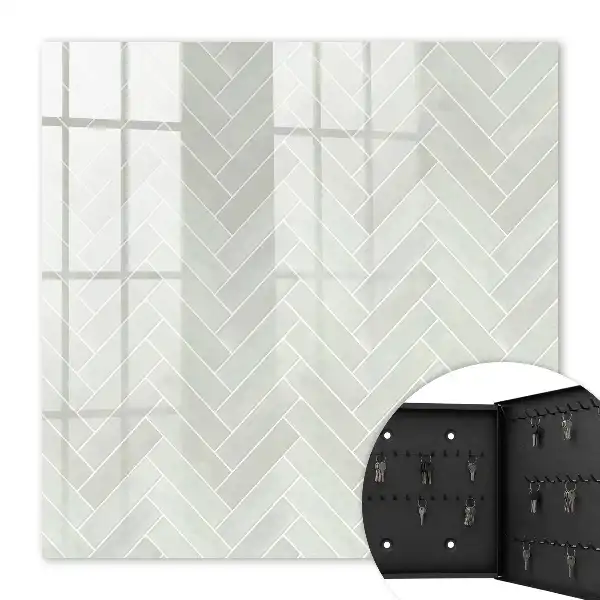 Herringbone pattern key cabinet in muted colors