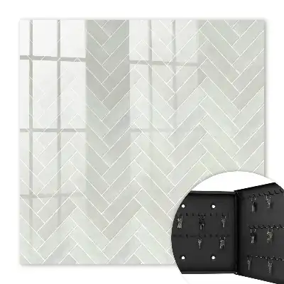 Herringbone pattern key cabinet in muted colors