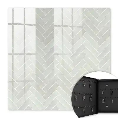 Herringbone pattern key cabinet in muted colors