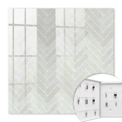 Herringbone pattern key cabinet in muted colors