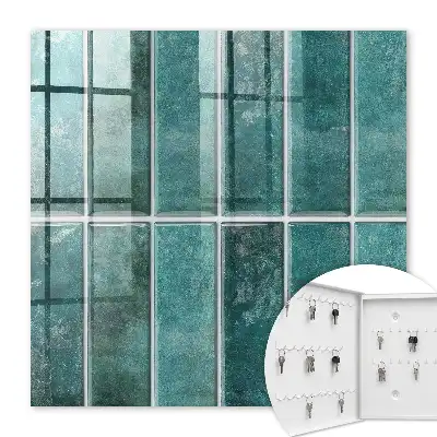 Wall mounted key cabinet Turquoise tiles enrich the space