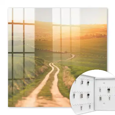 Wall mounted key cabinet A picturesque landscape with green fields