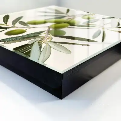 Wall mounted key cabinet A branch with olives in the cream background