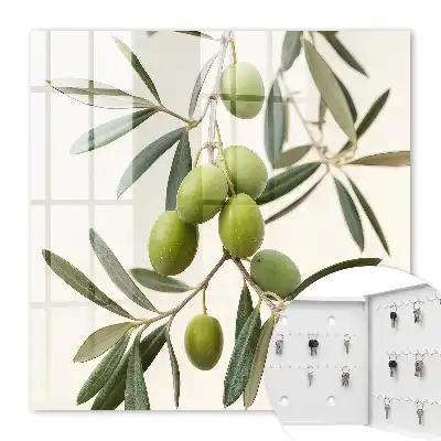 Wall mounted key cabinet A branch with olives in the cream background