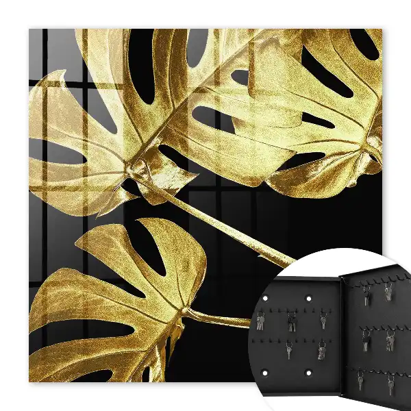 Key cabinet Monstera leaves in black background