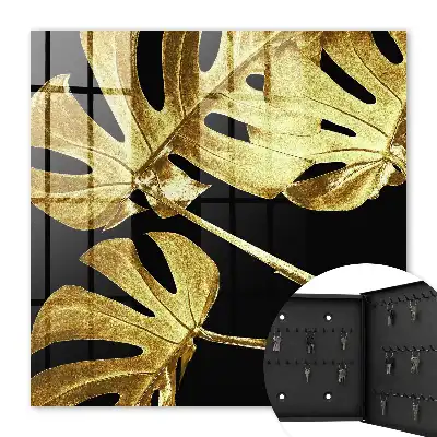 Key cabinet Monstera leaves in black background