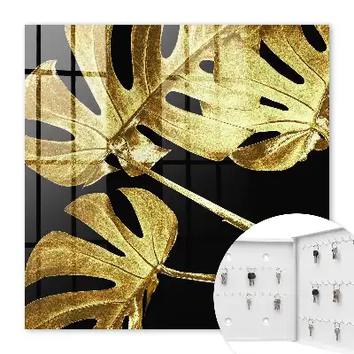 Key cabinet Monstera leaves in black background