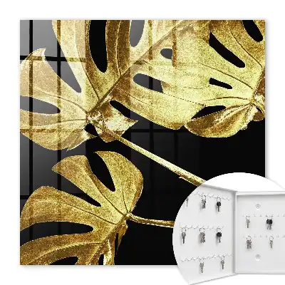 Key cabinet Monstera leaves in black background