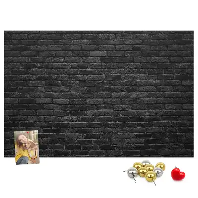 Printed cork board with a dark brick wall design