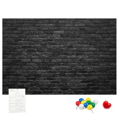Printed cork board with a dark brick wall design