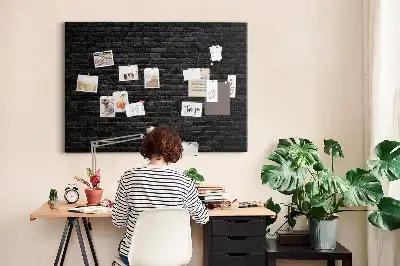 Printed cork board with a dark brick wall design