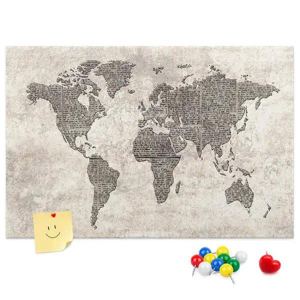Cork memo board with newspaper world map print