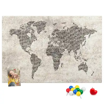 Cork memo board with newspaper world map print