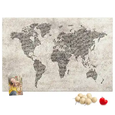 Cork memo board with newspaper world map print
