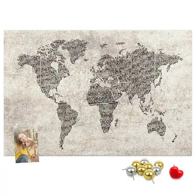 Cork memo board with newspaper world map print
