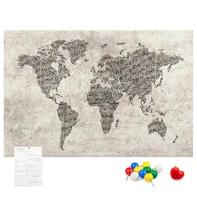 Cork memo board with newspaper world map print